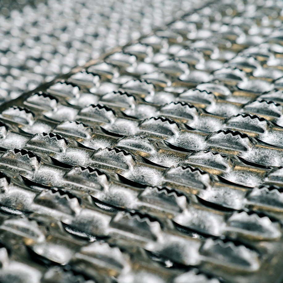Close-up of textured diamond-plate steel